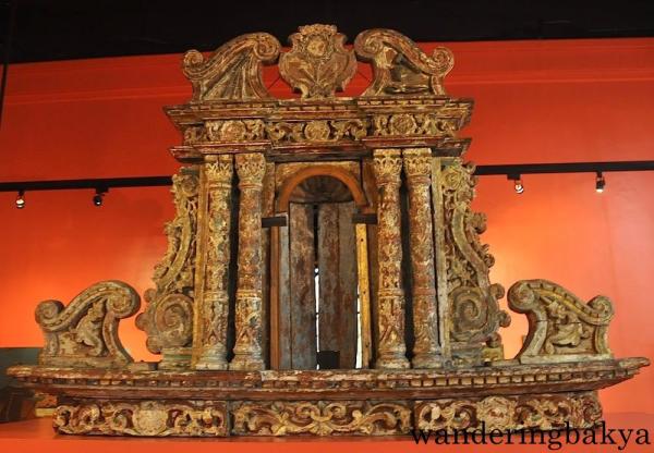 Retablo, smaller one opposite the one on top (Side Altar) of Church of San Nicolas de Tolentino, Dimiao, Bohol by an unknown artist (Wood)